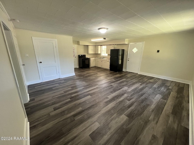 unfurnished living room featuring dark wood-type flooring