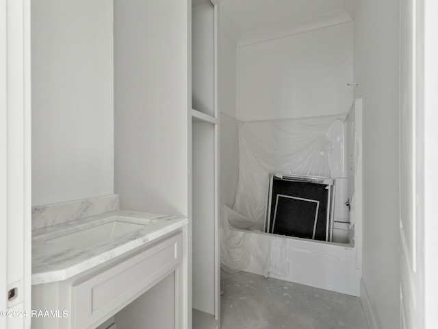 bathroom with vanity and concrete floors