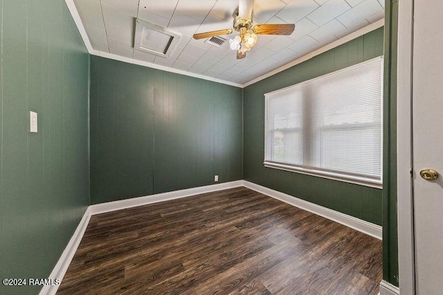 unfurnished room featuring crown molding, dark wood-type flooring, and ceiling fan