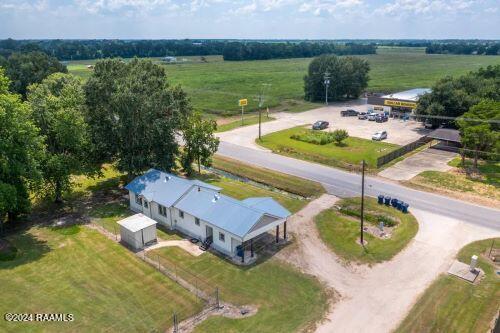 birds eye view of property featuring a rural view