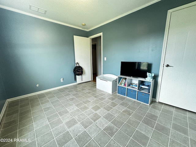 interior space featuring crown molding and a textured ceiling