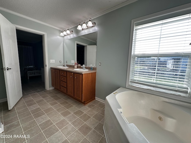 bathroom with a bath, a textured ceiling, tile patterned floors, vanity, and ornamental molding