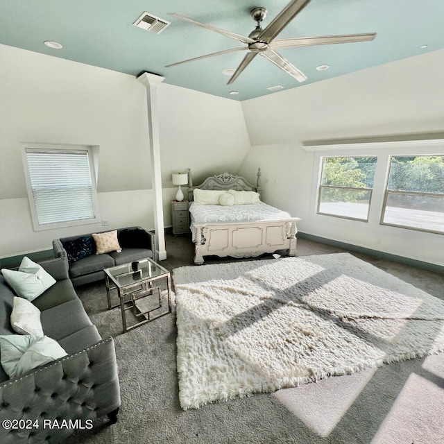 carpeted bedroom featuring lofted ceiling and ceiling fan