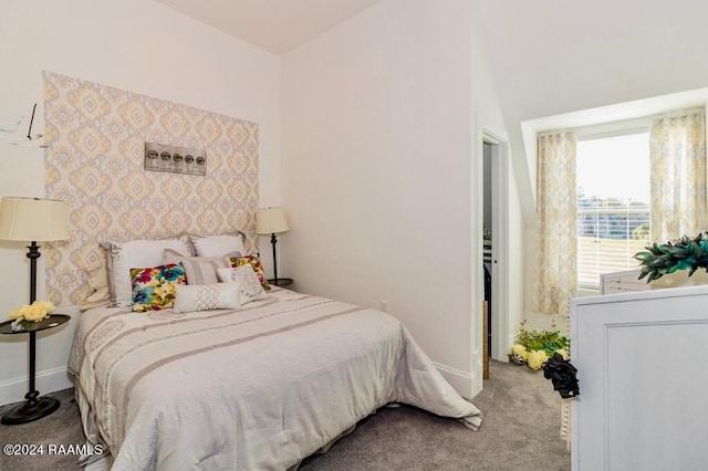 bedroom featuring baseboards and carpet flooring