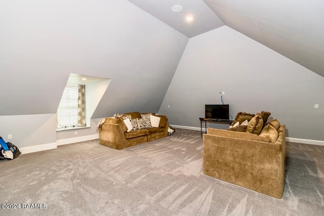 interior space featuring vaulted ceiling and carpet flooring