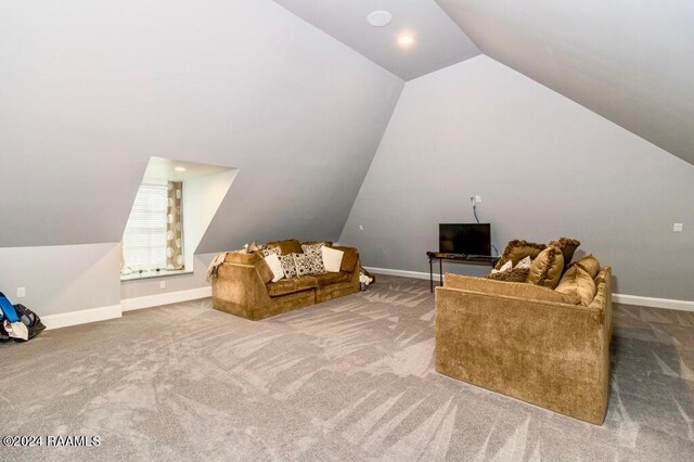 bonus room featuring baseboards, vaulted ceiling, and carpet flooring