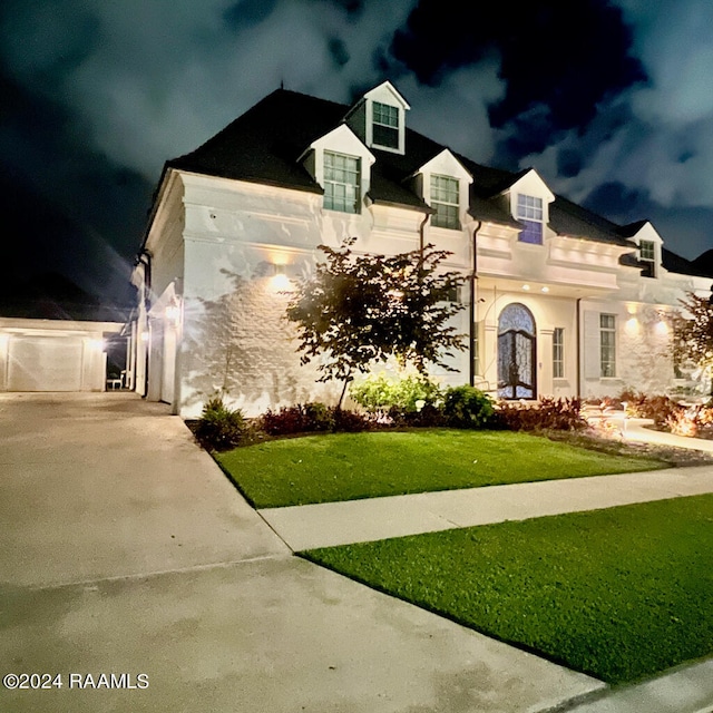 view of front of property with a lawn