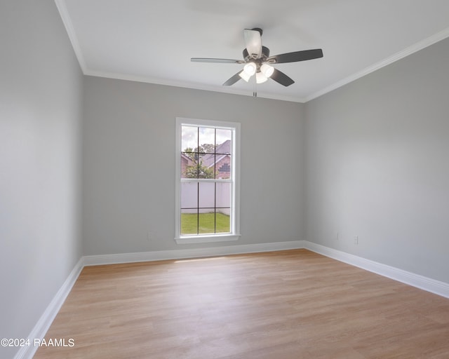 spare room featuring light hardwood / wood-style floors, ornamental molding, and ceiling fan