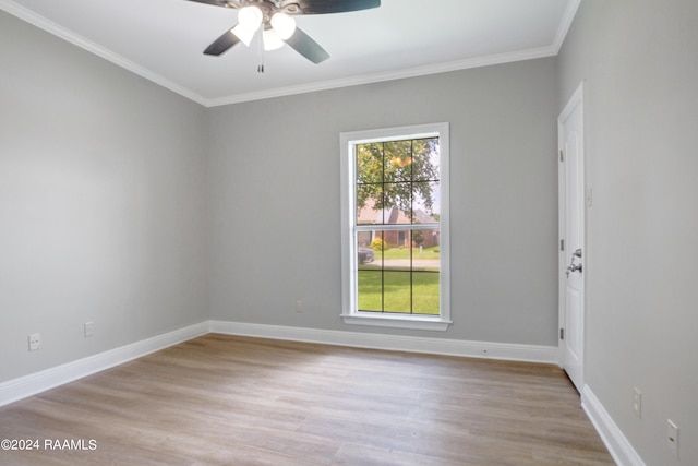 spare room with light hardwood / wood-style floors, ceiling fan, plenty of natural light, and crown molding