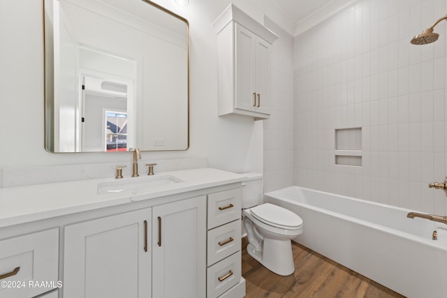 full bathroom with hardwood / wood-style flooring, vanity, ornamental molding,  shower combination, and toilet