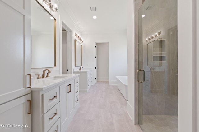 bathroom with ornamental molding, shower with separate bathtub, and vanity