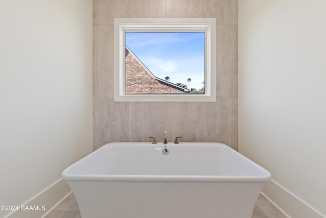 bathroom with a washtub