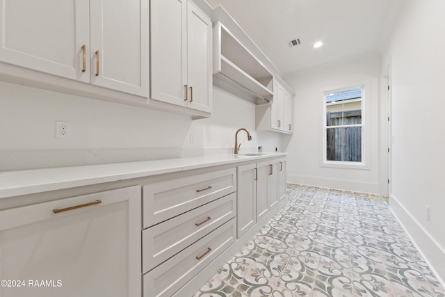 kitchen with sink and white cabinets