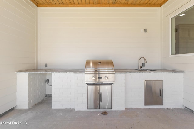 view of patio / terrace featuring area for grilling, an outdoor kitchen, and sink