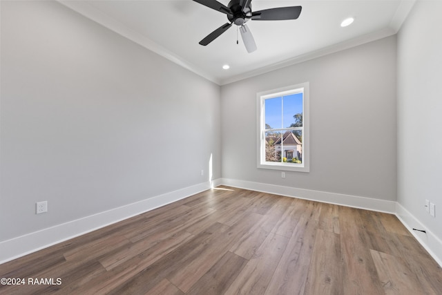 spare room with crown molding, ceiling fan, and light hardwood / wood-style floors