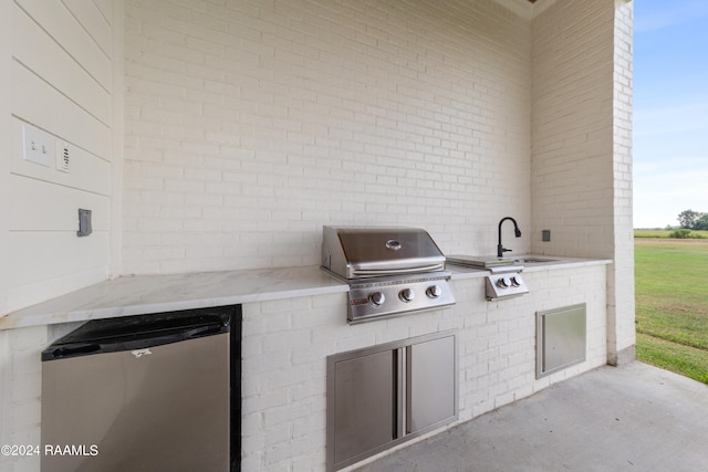 view of patio featuring sink, grilling area, and area for grilling