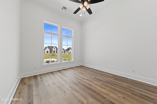 unfurnished room with crown molding, hardwood / wood-style floors, and ceiling fan