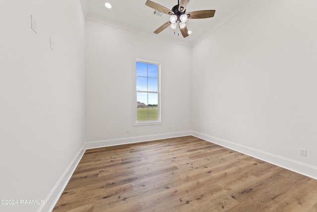 unfurnished room with ceiling fan, light hardwood / wood-style flooring, and ornamental molding