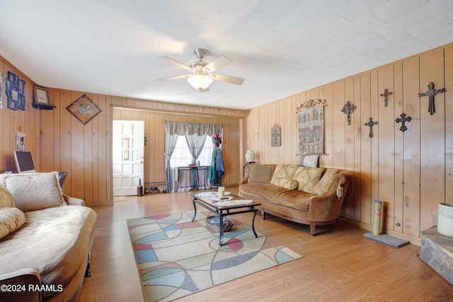 living room featuring ceiling fan and light wood-type flooring