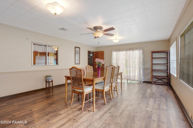 dining area with ceiling fan and wood-type flooring