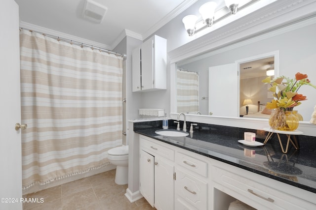 bathroom with tile patterned flooring, vanity, toilet, and ornamental molding