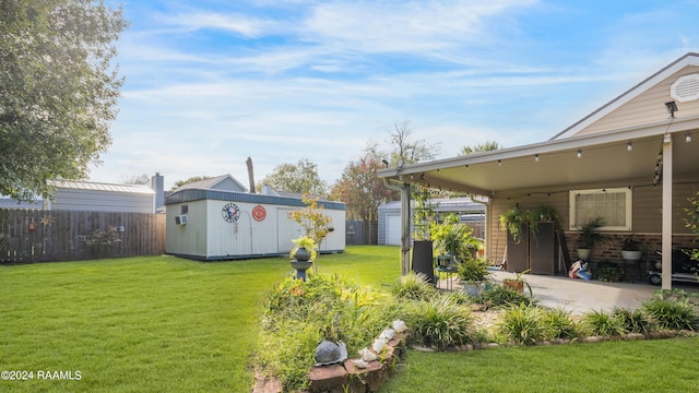 view of yard featuring a patio and a storage unit