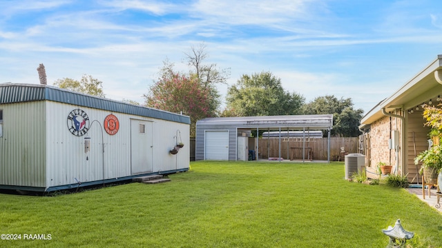 view of yard with central AC, a shed, and a carport