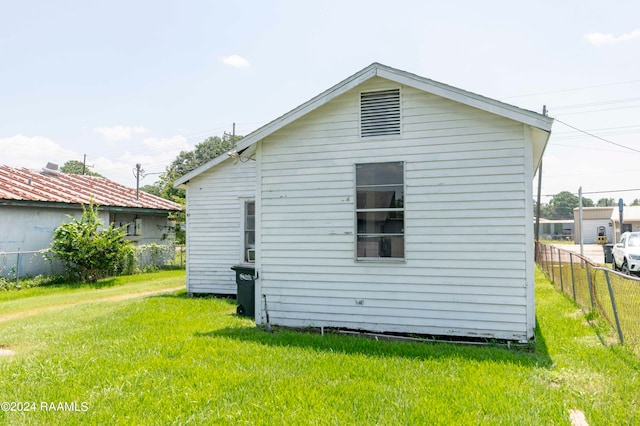 back of property featuring a yard