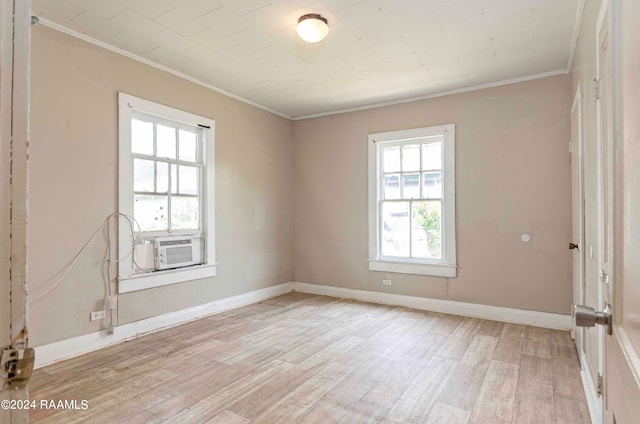 unfurnished room featuring ornamental molding, cooling unit, and light hardwood / wood-style floors