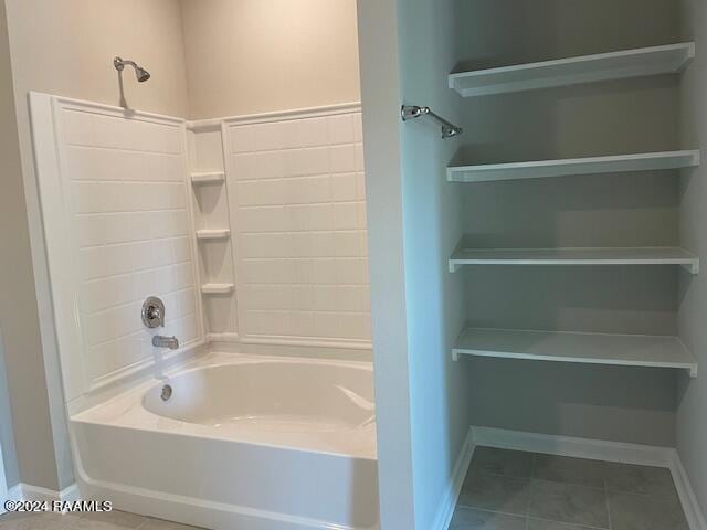 bathroom featuring bathtub / shower combination and tile patterned flooring