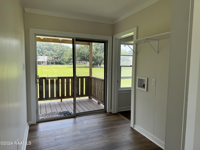 doorway to outside with hardwood / wood-style floors and crown molding