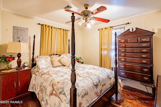 bedroom with crown molding, dark hardwood / wood-style floors, and ceiling fan