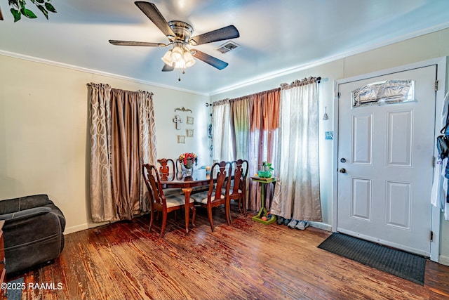 dining area featuring ceiling fan, dark hardwood / wood-style flooring, and ornamental molding