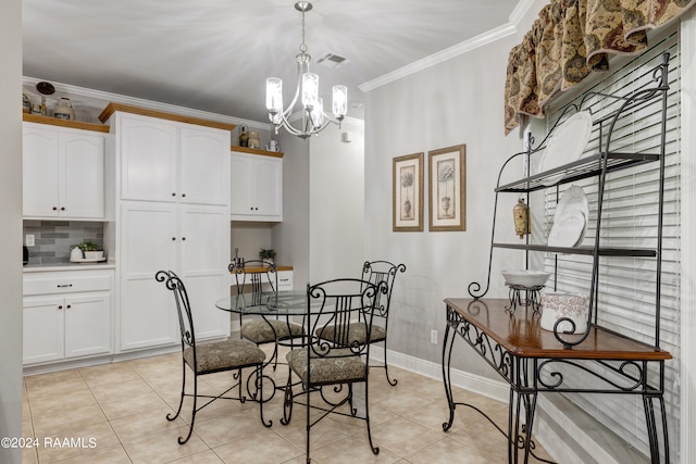 tiled dining space featuring crown molding and a chandelier