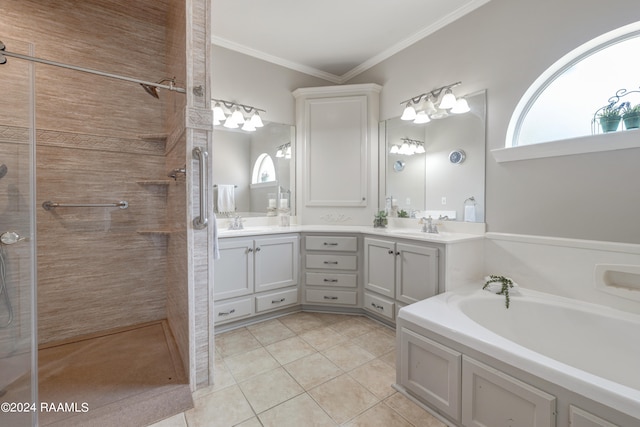 bathroom featuring separate shower and tub, a healthy amount of sunlight, tile patterned floors, and vanity