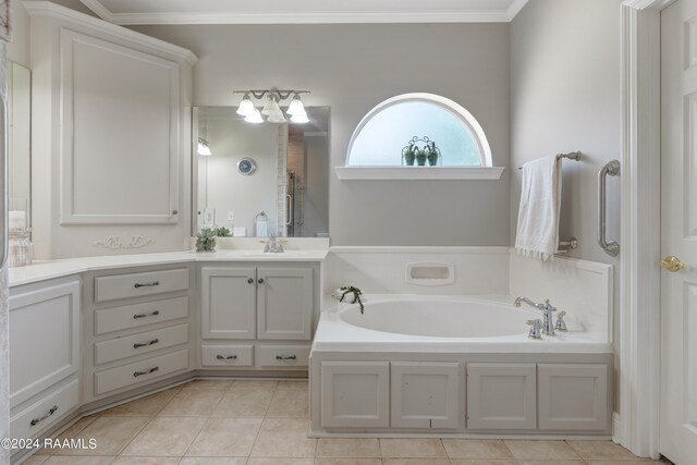 bathroom featuring a washtub, crown molding, tile patterned flooring, and vanity