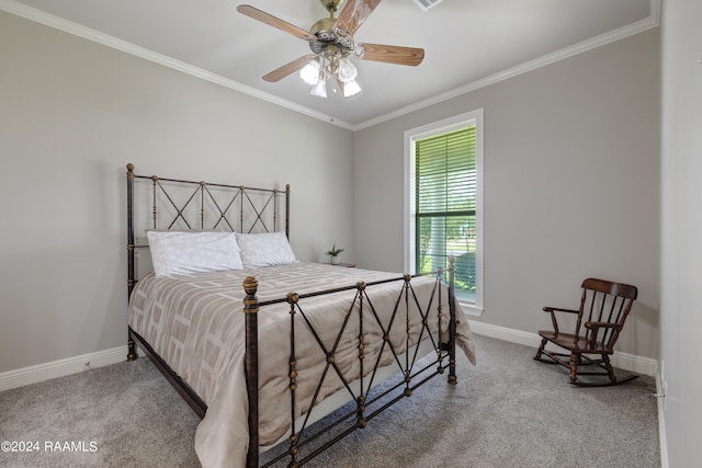 carpeted bedroom with ceiling fan and crown molding