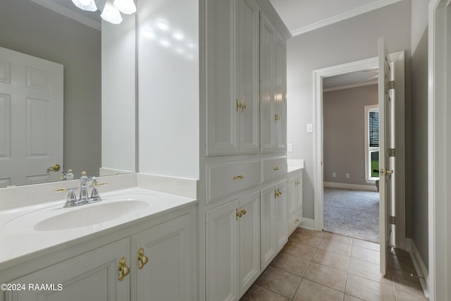 bathroom with tile patterned flooring, vanity, and ornamental molding