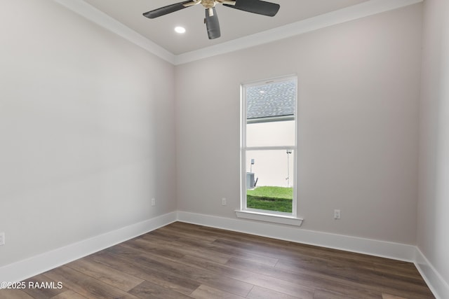 empty room with ceiling fan, crown molding, and dark hardwood / wood-style floors