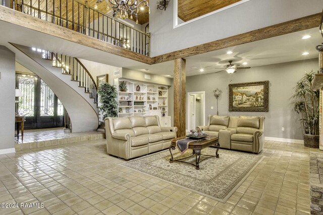 415 Fort Hamilton Dr, Opelousas, LA 70570 - living room with baseboards, recessed lighting, ceiling fan with notable chandelier, and a high ceiling