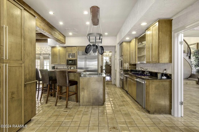 415 Fort Hamilton Dr, Opelousas, LA 70570 - kitchen with recessed lighting, open shelves, built in appliances, backsplash, and a sink