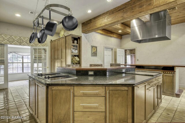 415 Fort Hamilton Dr, Opelousas, LA 70570 - kitchen featuring dark stone countertops, light tile patterned floors, black electric stovetop, beamed ceiling, and recessed lighting