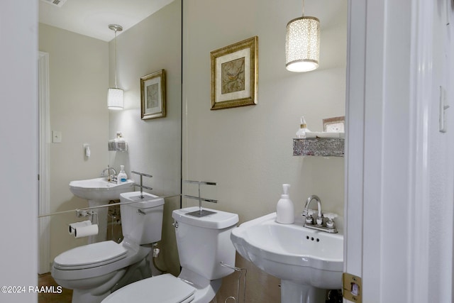 bathroom featuring sink and toilet