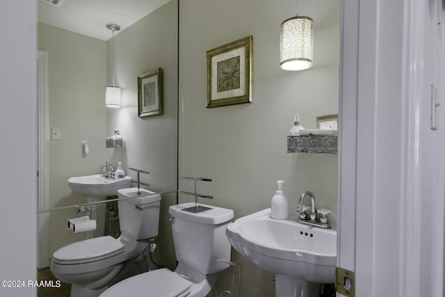 415 Fort Hamilton Dr, Opelousas, LA 70570 - half bathroom with visible vents, toilet, and a sink