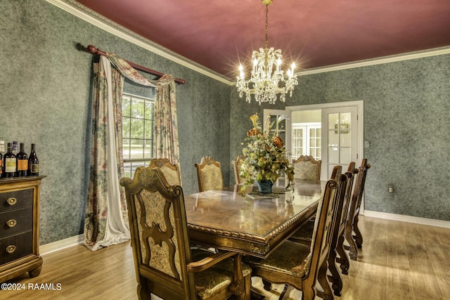 415 Fort Hamilton Dr, Opelousas, LA 70570 - dining room featuring wood finished floors, an inviting chandelier, and crown molding