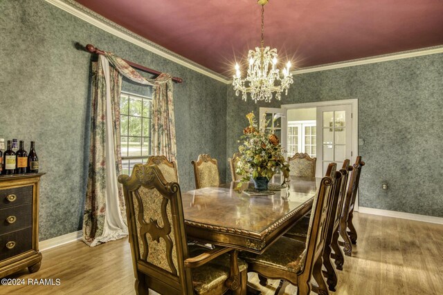 415 Fort Hamilton Dr, Opelousas, LA 70570 - dining room featuring wood finished floors, an inviting chandelier, and crown molding