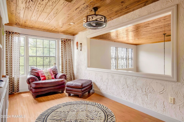 sitting room featuring light hardwood / wood-style flooring and wooden ceiling