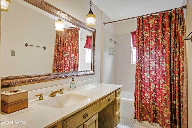 bathroom featuring tile patterned floors, vanity, a healthy amount of sunlight, and shower / bath combo