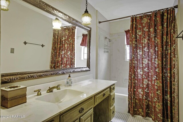 415 Fort Hamilton Dr, Opelousas, LA 70570 - full bathroom with shower / bath combination with curtain, plenty of natural light, tile patterned flooring, and vanity