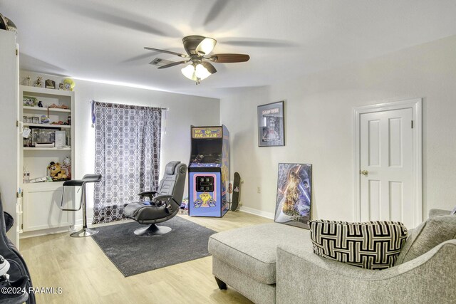 415 Fort Hamilton Dr, Opelousas, LA 70570 - interior space featuring a ceiling fan, light wood finished floors, and baseboards